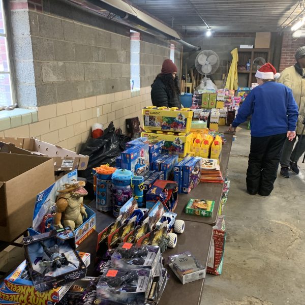 Tables filled with donated toys prepared for distribution during the Second District Christmas Drive Thru event.