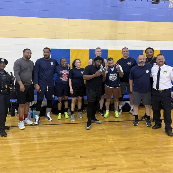 Cleveland Police team poses for a group photo on the court after the game