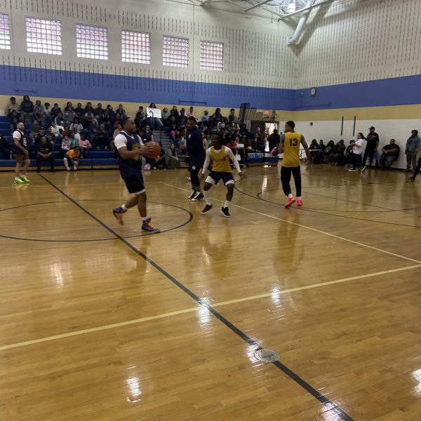 Cleveland Police officers and Willson School players during gameplay on the court