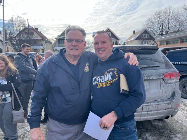 Bob Guttu and Officer Paul Beckwith pose together outside the Second District following the retirement ceremony
